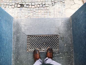 Person standing in front of built structure