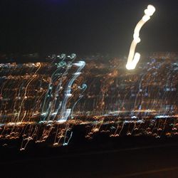 Aerial view of illuminated fireworks against sky at night