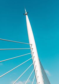 Low angle view of airplane against clear blue sky