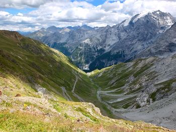 Scenic view of valley and mountains against sky