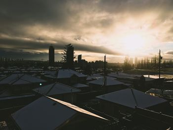 High angle view of buildings against sky during sunset