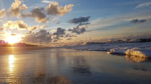 Scenic view of sea against sky at sunset