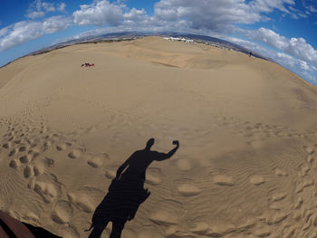 Shadow of man at desert