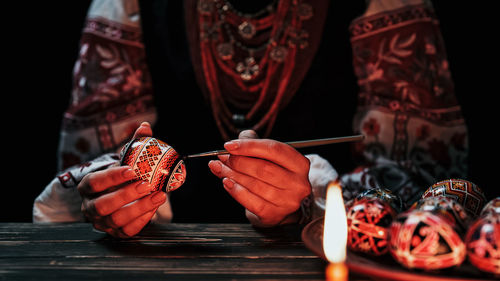 Close-up of hand holding cake