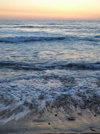 Scenic view of sea at sunset