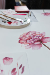 High angle view of pink flower on table