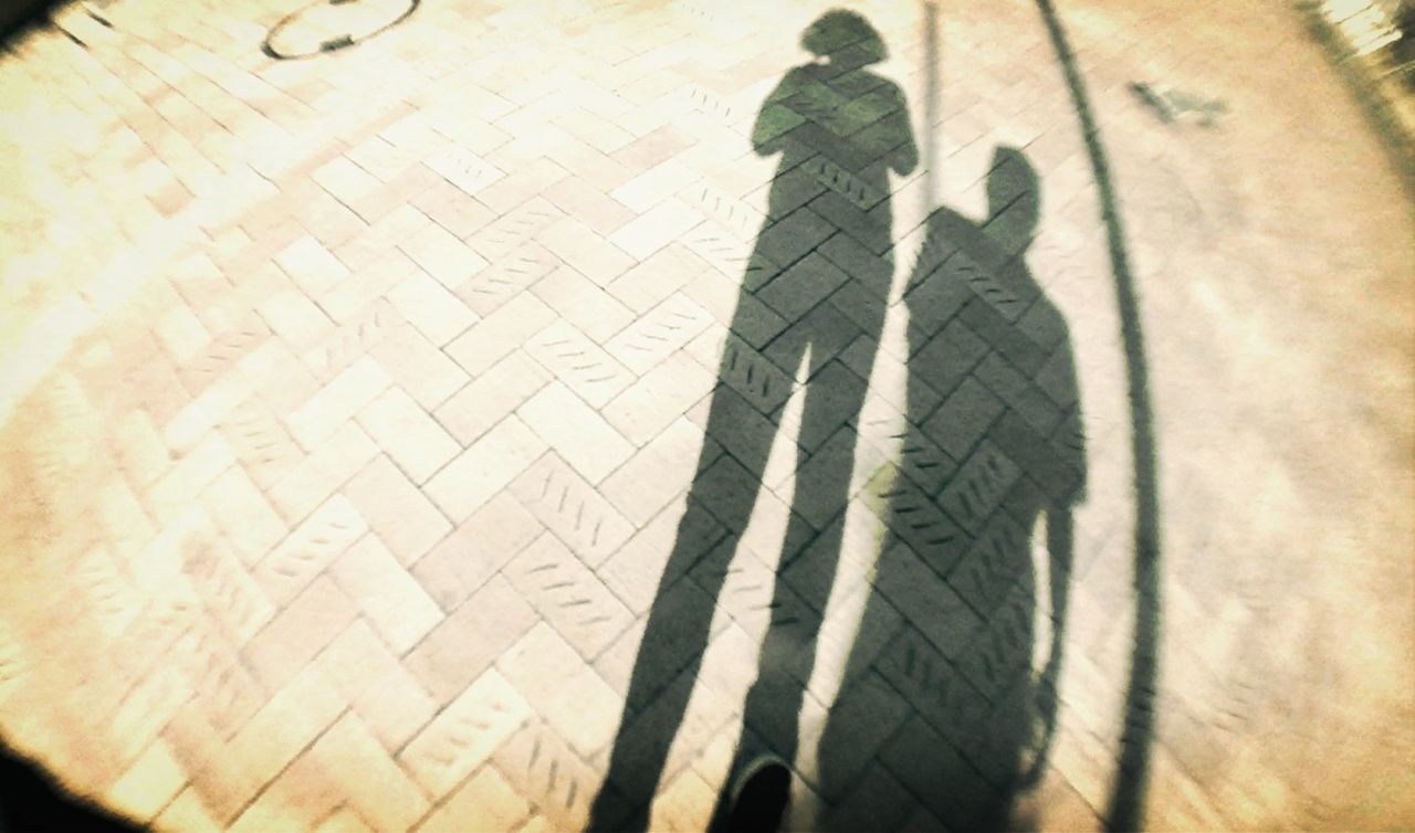 shadow, indoors, focus on shadow, wall - building feature, sunlight, silhouette, pattern, unrecognizable person, close-up, men, day, high angle view, lifestyles, wall, standing, low angle view
