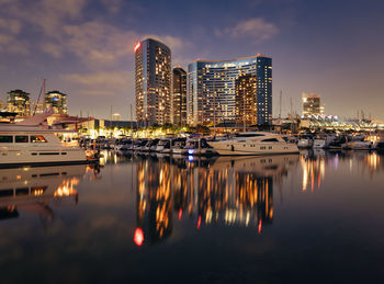 Reflection of buildings in water at night