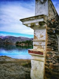 Scenic view of lake against cloudy sky