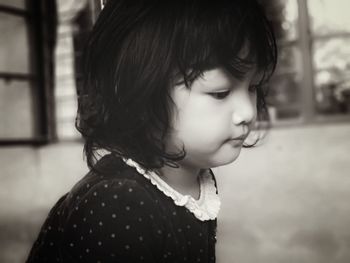 Close-up portrait of a girl looking away