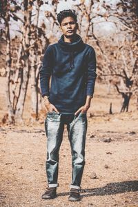 Portrait of young man standing on land