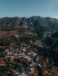 High angle view of trees and mountains against clear sky