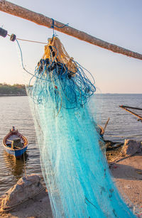 After the fish is caught, a fishing net is maintained directly at the pier