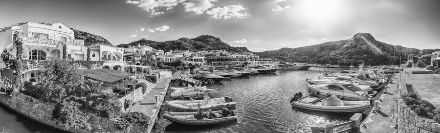 Sailboats moored in sea