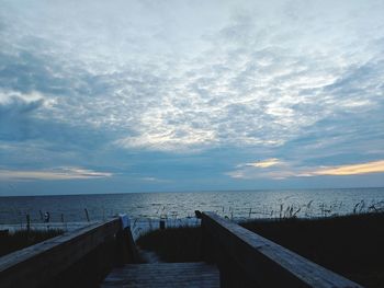 Pier over sea against sky