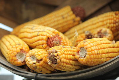 High angle view of sweetcorns in basket