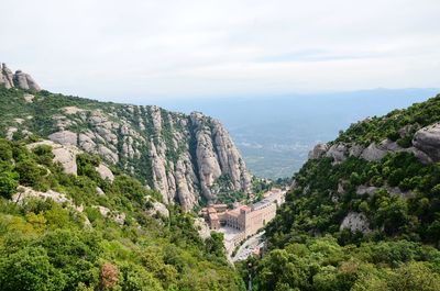 High angle view of trees and mountains against sky