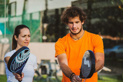 Portrait of smiling young man standing outdoors