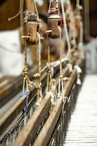 Close-up of chain hanging on railing