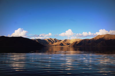 Scenic view of lake against blue sky