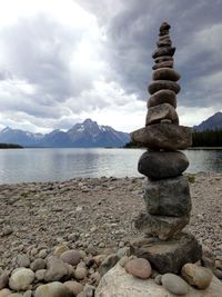 Stones on rocks at riverbank