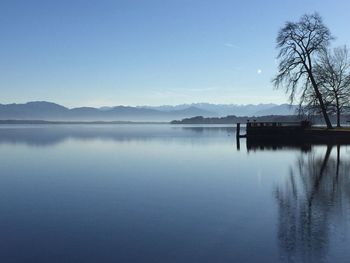 Scenic view of lake against clear blue sky