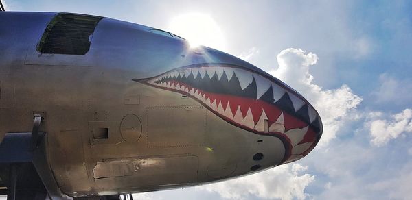 Low angle view of airplane flying in sky