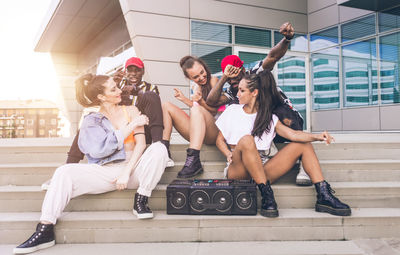 People sitting on wall