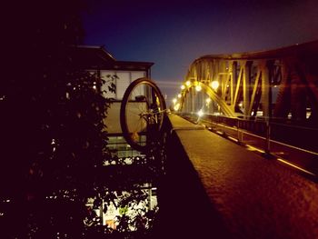 Bicycles against clear sky at night