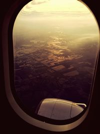 Aerial view of landscape seen through airplane window