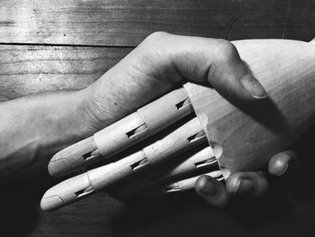 High angle view of person hand on table