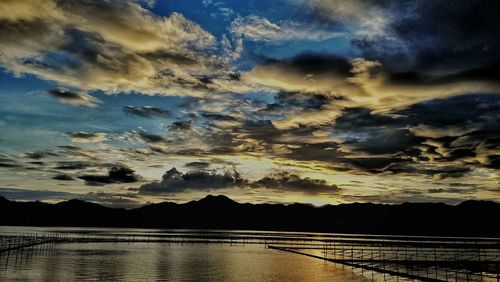 Scenic view of sea against cloudy sky