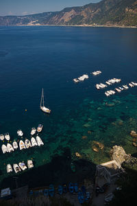 High angle view of sailboats in sea