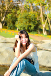 Young woman sitting on bench