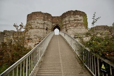 View of footbridge against sky