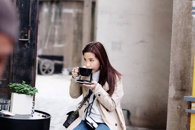 Young woman having coffee