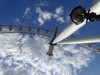 Low angle view of ferris wheel against sky