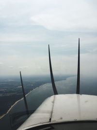 Cropped image of airplane against sky