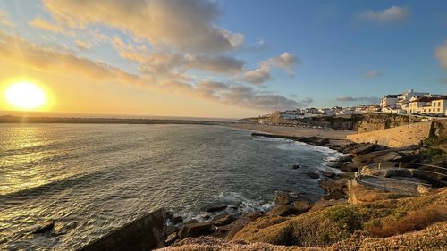 Scenic view of sea against sky during sunset