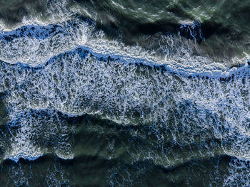High angle view of water splashing in sea
