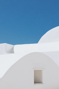 Low angle view of building against clear blue sky