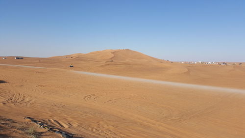 Scenic view of desert against clear sky