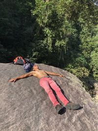 Low section of man standing on rock