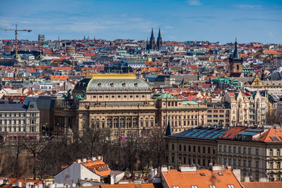 National theatre building and prague city old town seen from petrin hill in an early spring day