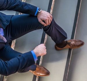 High angle view of man sitting on steps