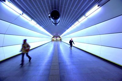 People walking in tunnel