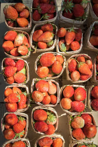 High angle view of strawberries for sale at market stall