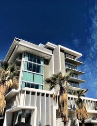 Low angle view of building against blue sky