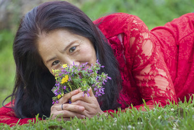 Portrait of woman with pink flowers