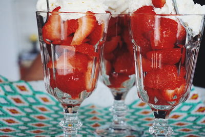 Close-up of strawberries with whipped cream